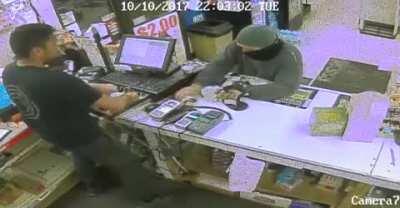 DBS robber gets tricked by the store clerk and losses the gun!