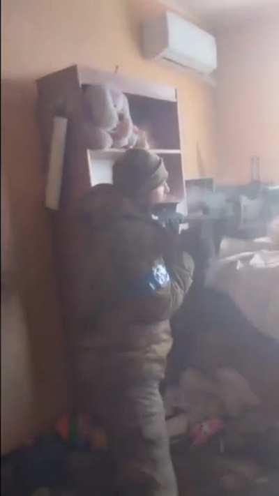 Ukrainian firing DShK from a building upper level in Bakhmut