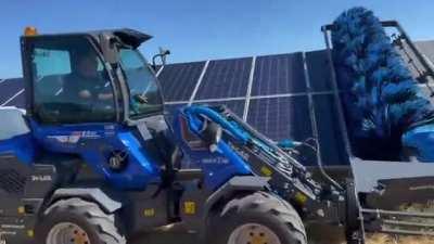 Cleaning the solar panels.