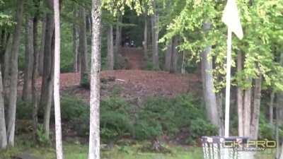 Disc golfer (Kevin Jones) slips on the teepad but still manages to get an ace on 530ft hole