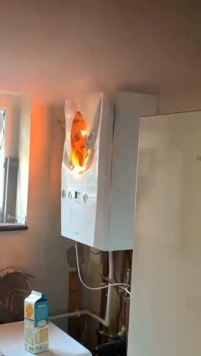 A boiler on fire in a uk home. Date unknown. 