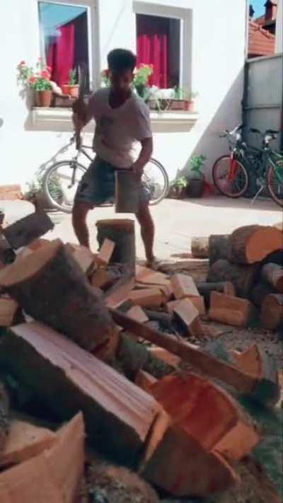 the man is very professional in cutting wood