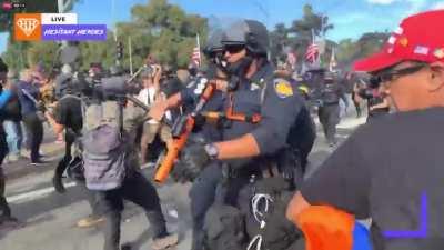 Conservative man defending his flag from liberal Antifa thief gets the ever-living shit beat out of him by Antifa mob