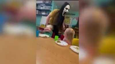 to scream at children in Halloween mask at daycare.