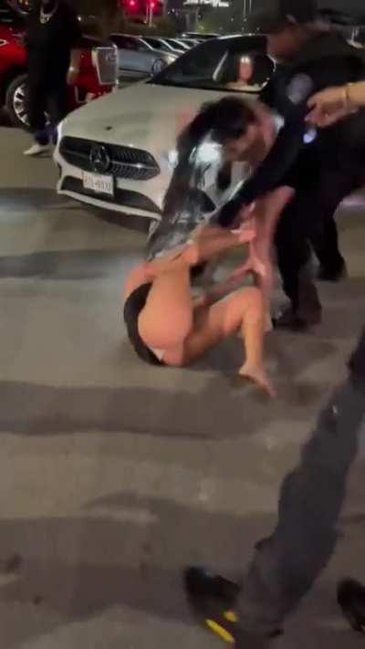 Officer choke slams girl unconscious.