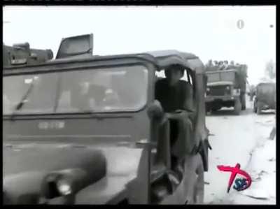 Footage of North Vietnamese forces marching through various abandoned or destroyed ARVN military vehicles on the road of Huế, the Vietnam war 1975