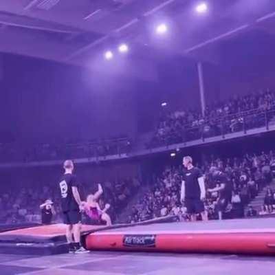 Gymnast does a forward backflip