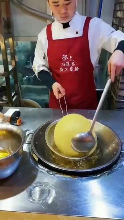 This chef making a perfect Jian Dui (Fried Sesame Dessert Balls)