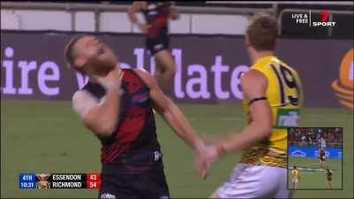 Tom Lynch hits Hurley in the throat behind the play