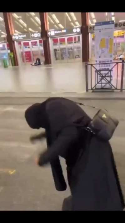 A woman in Italy freaks out in response to seeing a man and woman kiss in public
