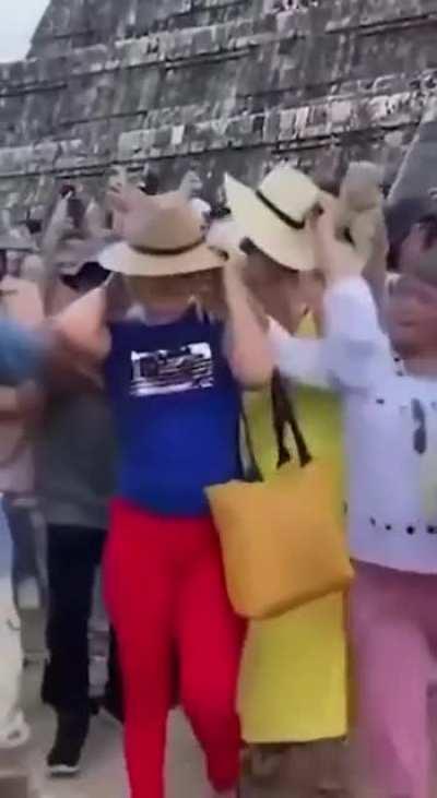 Tourist climbs a sacred Mayan pyramid and dances at the top before being attacked by a group of angry locals.