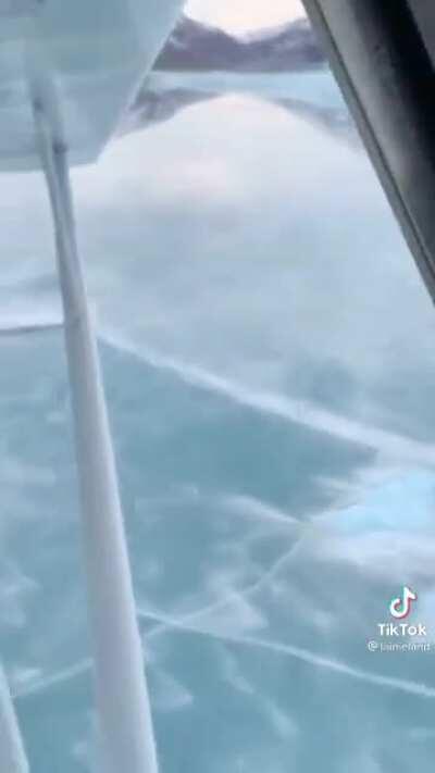 Woman takes her plane on the ice to go ice skating