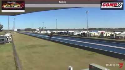 Camaro goes airborne in a drag race, proceeds to stick the landing and keep going