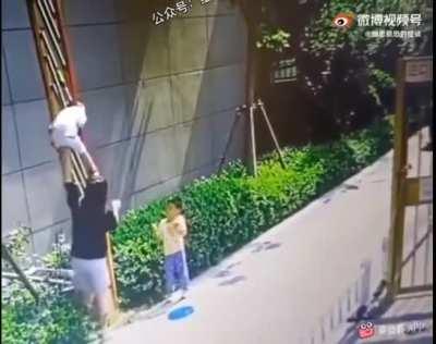 Letting the kids cross through an automatic fence boom barrier