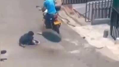 WCGW trying to steal a manhole cover