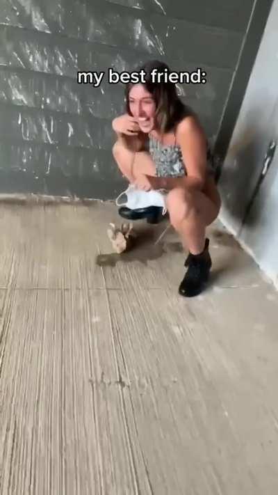 She pisses on the floor of a public building, takes off her mask and uses it to cover up her vag