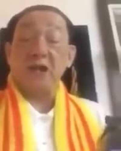 Old Asian guy with a gun