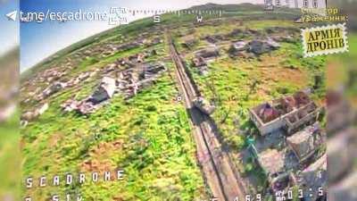 Ukrainian FPV loitering drone targets a Russian BTR in Marinka (Music from source)