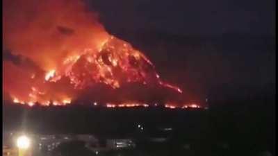 Yesterday, Wildfire engulfs a Thai mountain.