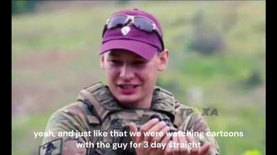Ukrainian soldiers sharing their experience with a POW