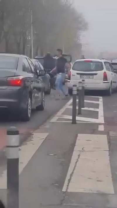 Two guys fight in traffic, in Zagreb 