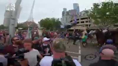 Anti-lockdown protester hits horse and accuses it of racism