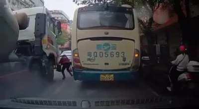 Wife watches husband walk in front of concrete mixer and get run over. China, 6 December 2023