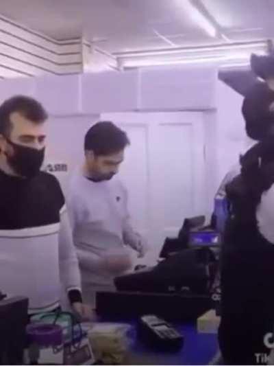 man with debit card in mask