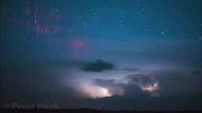 Red sprites are large scale electrical discharges that are sometimes seen high above thunderstorms in the upper atmosphere. They can be massive, sometimes 50 kilometers tall by 50 kilometers wide