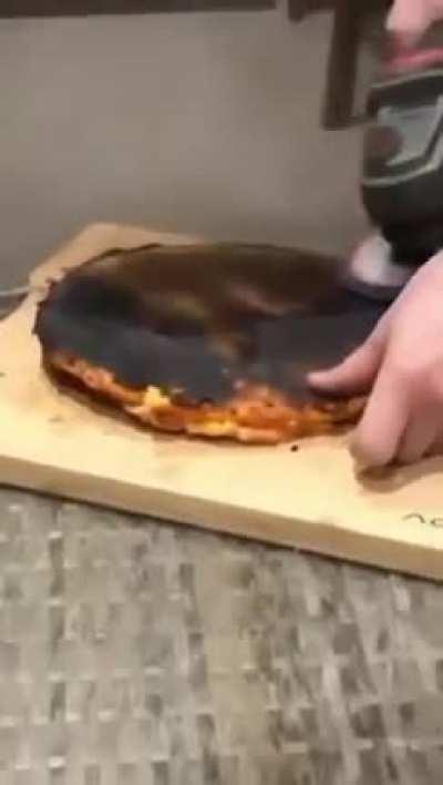 The burnt part of pizza is removed properly