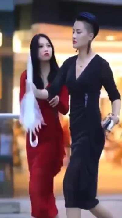 Loora Wang opens an umbrella