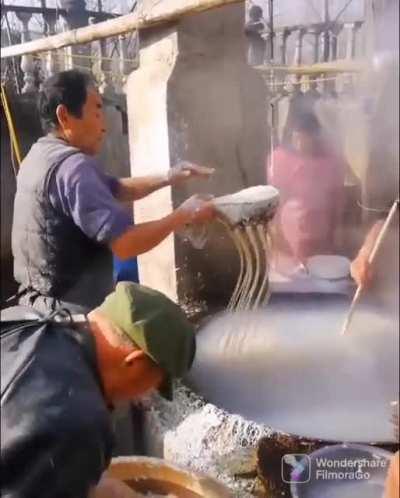 Traditional way of making noodles in Chongqing, China