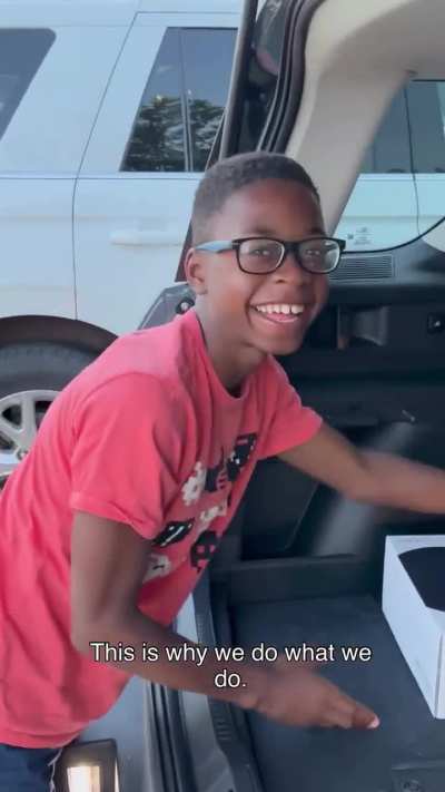 A father surprises his son with a gift