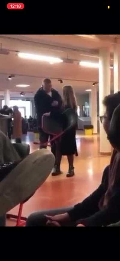 Girl takes chair from kid, big friend shows up