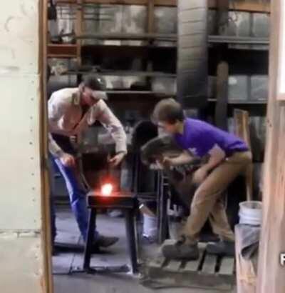 Hammering hot metal