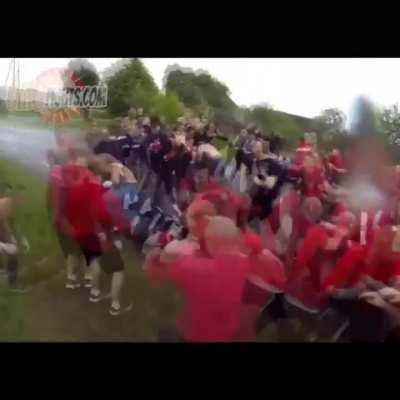 Hardcore Soccer fans meet up to fight, 30v30 street fight style.