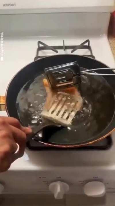 Frying up a chicharron