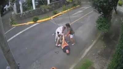 Man saves woman from pit attack.