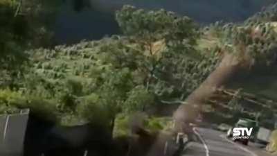 Driver tries to overtake row of cars and meets a tractor trailer