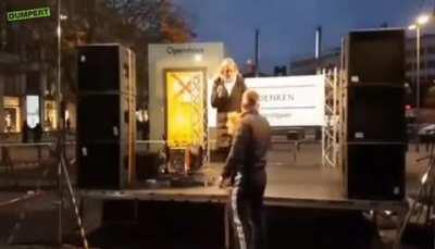 Dumbass german woman compairing the holocaust and wearing a mask, then gets owned by security guy