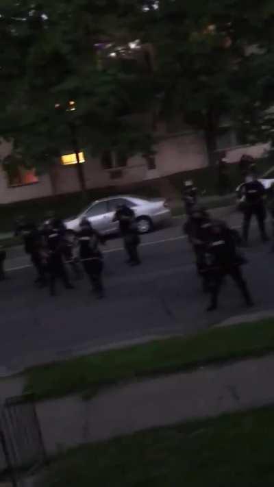 Police and National Guard patrolling neighborhood and shooting civilians on their own property.