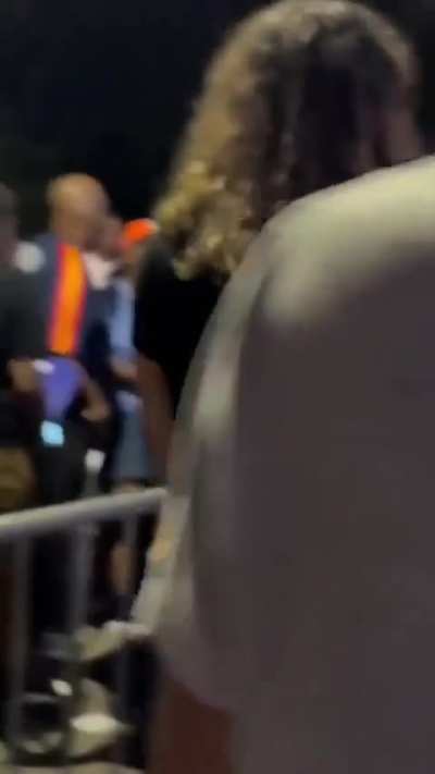 Woman screams at a child in stroller outside Kamala Harris rally
