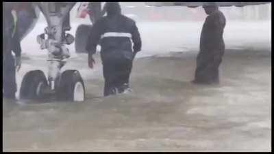 An airport flooded with rain water to knee level in chennai, india