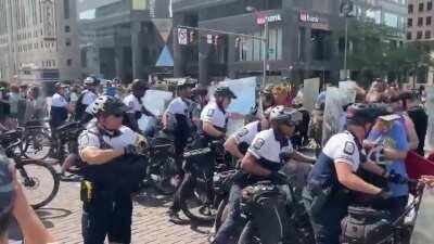 Columbus, OH - Bike cops vs. Protesters w/ heavy duty signs