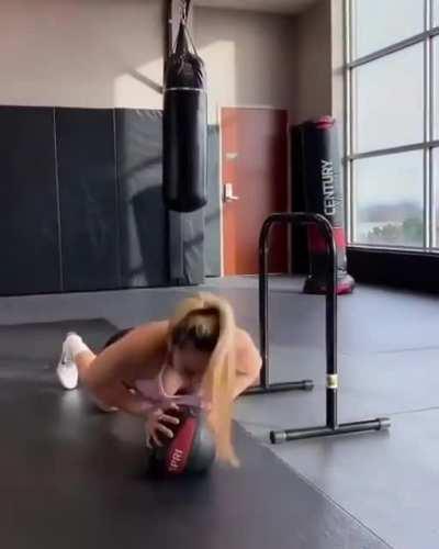 Trying to jump a horizontal pole holding a medicine ball