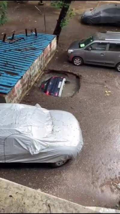 A car being swallowed