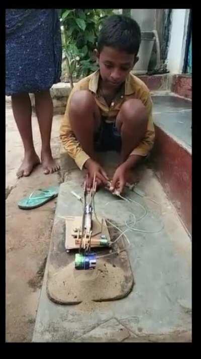 A young Indian kid builds his toy