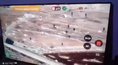 Alleged drone footage of fleeing Russian and Syrian soldiers near Aleppo, Syria. Advancing anti-Assad forces killed and captured several Russian soldiers and also looted Russian and Syrian army equipment. (Russian military bloggers insist that is only Syr