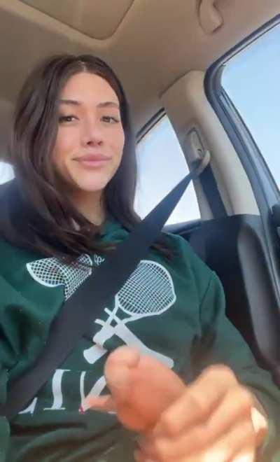 Playing with her racquet.