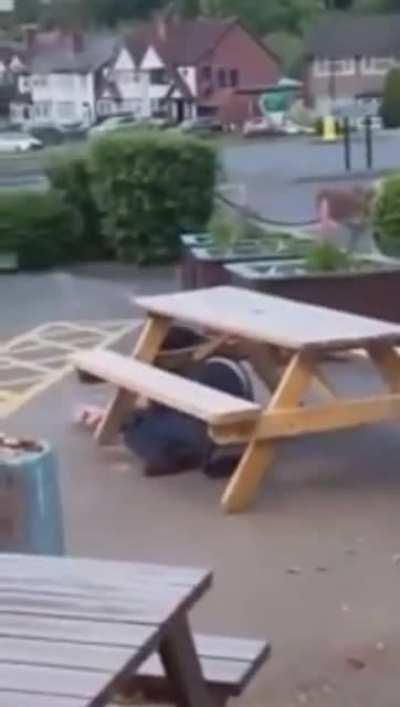 Angry drunk guy tries to flip a table